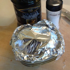 Cover your baking dish with foil so that your garlic doesn't dry out in the oven.